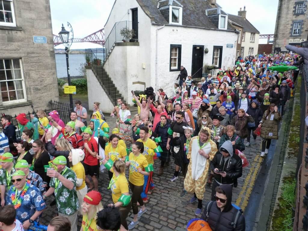 Marching through the streets for the Loony Dook dip